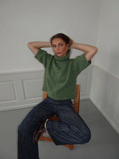 Green short-sleeve turtleneck knit